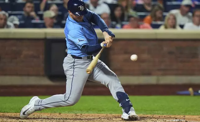 Tampa Bay Rays' Danny Jansen hits a two-run home run during the sixth inning of a baseball game against the New York Mets Friday, June 13, 2025, in New York. (AP Photo/Frank Franklin II)