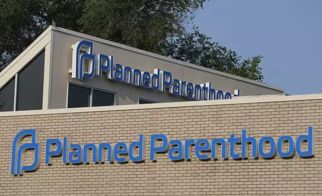 FILE - A Planned Parenthood sign is displayed on the outside of the clinic, Aug. 1, 2023, in Indianapolis. (AP Photo/Darron Cummings, File)
