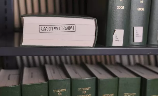 Books rest on a shelves at Langdell Hall, which houses the Harvard Law School library, Wednesday, Feb. 26, 2025, in Cambridge, Mass. (AP Photo/Charles Krupa)