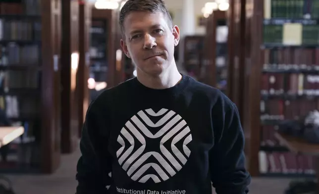 Greg Leppert, executive director at the Institutional Data Initiative, poses at Langdell Hall, which houses the Harvard Law School library, Wednesday, Feb. 26, 2025, in Cambridge, Mass. (AP Photo/Charles Krupa)