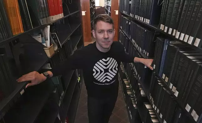 Greg Leppert, executive director at the Institutional Data Initiative, poses at Langdell Hall, which houses the Harvard Law School library, Wednesday, Feb. 26, 2025, in Cambridge, Mass. (AP Photo/Charles Krupa)