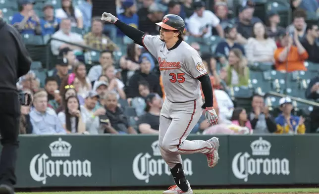Baltimore Orioles' Adley Rutschman jogs the bases after hitting a solo home run off Seattle Mariners starting pitcher Emerson Hancock during the sixth inning of a baseball game, Wednesday, June 4, 2025, in Seattle. (AP Photo/Jason Redmond)