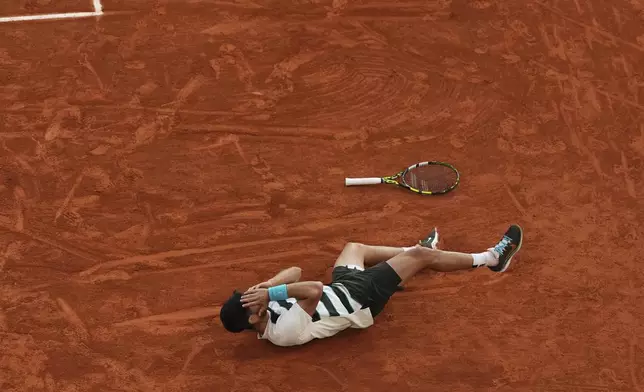 Spain's Carlos Alcaraz celebrates after winning the final match of the French Tennis Open against Italy's Jannik Sinner at the Roland-Garros stadium in Paris, Sunday, June 8, 2025. (AP Photo/Lindsey Wasson)