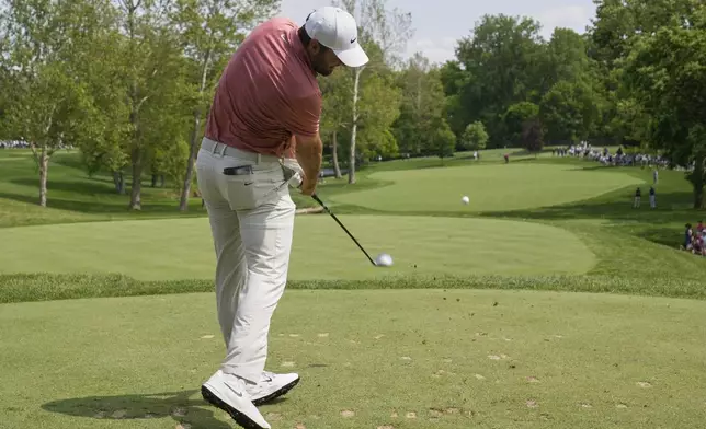 Scottie Scheffler hits from the third tee during the third round of the Memorial golf tournament Saturday, May 31, 2025, in Dublin, Ohio. (AP Photo/Sue Ogrocki)