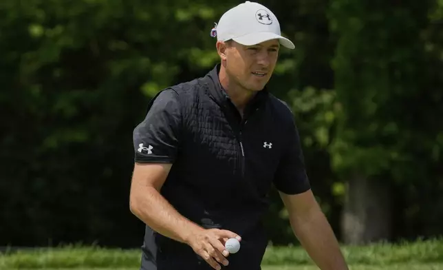 Jordan Spieth gestures after his putt on the first green in the third round of the Memorial golf tournament Saturday, May 31, 2025, in Dublin, Ohio. (AP Photo/Sue Ogrocki)