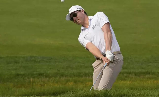 Ben Griffin chips onto the ninth green during the third round of the Memorial golf tournament Saturday, May 31, 2025, in Dublin, Ohio. (AP Photo/Sue Ogrocki)