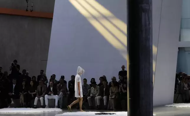 A model wears a creation as part of the men's Prada Spring-Summer 2026 collection, that was presented in Milan, Italy, Sunday, June 22, 2025. (AP Photo/Luca Bruno)