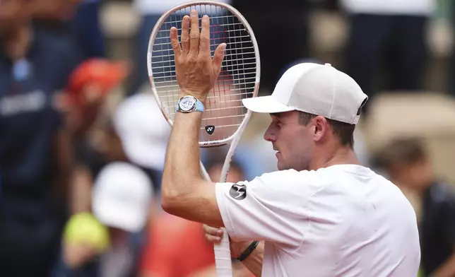 Tommy Paul of the U.S. reacts after beating Australia's Alexei Popyrin during their fourth round match of the French Tennis Open, at the Roland-Garros stadium, in Paris, Sunday, June 1 2025. (AP Photo/Lindsey Wasson)