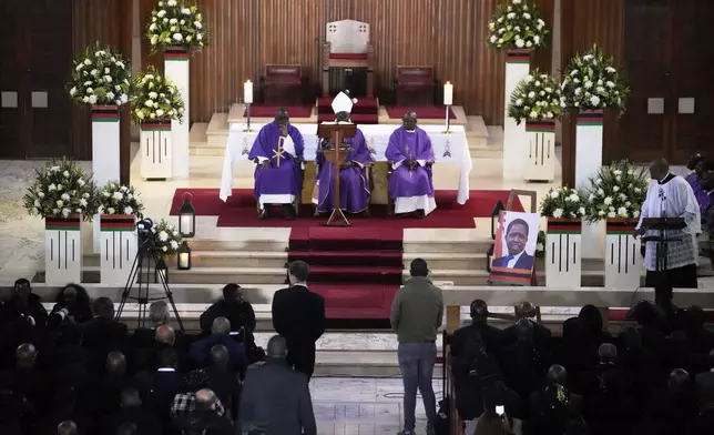 A Mass for former Zambian President Edgar Lungu is celebrated at the Cathedral of Christ the King, in Johannesburg, South Africa, Wednesday, June 25, 2025. (AP Photo/Themba Hadebe)