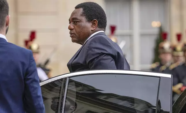 FILE - Zambian President Hakainde Hichilema arrives at the Elysee Palace in Paris, Wednesday, May 10, 2023, to meet French President Emmanuel Macron. Zambian President Hakainde Hichilema will discuss with French President Emmanuel Macron on economic issues. (AP Photo/Michel Euler, file)