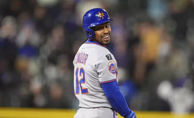 New York Mets pinch-hitter Francisco Lindor smiles after reaching second base on a double to drive in two runs off Colorado Rockies relief pitcher Zach Agnos in the ninth inning of a baseball game Friday, June 6, 2025, in Denver. (AP Photo/David Zalubowski)