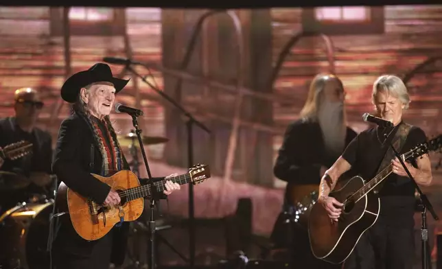 FILE - Willie Nelson, left, and Kris Kristofferson perform on stage at the 56th annual Grammy Awards on Jan. 26, 2014, in Los Angeles. (Photo by Matt Sayles/Invision/AP, File)