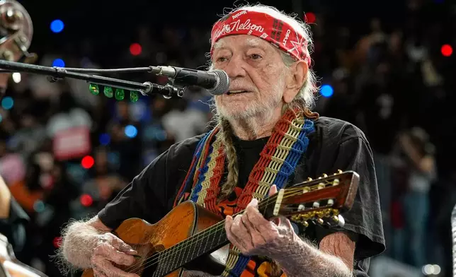 FILE - Musician Willie Nelson performing ahead of event for Democratic presidential nominee Vice President Kamala Harris at a rally in Houston, Friday, Oct. 25, 2024. (AP Photo/Susan Walsh, File)