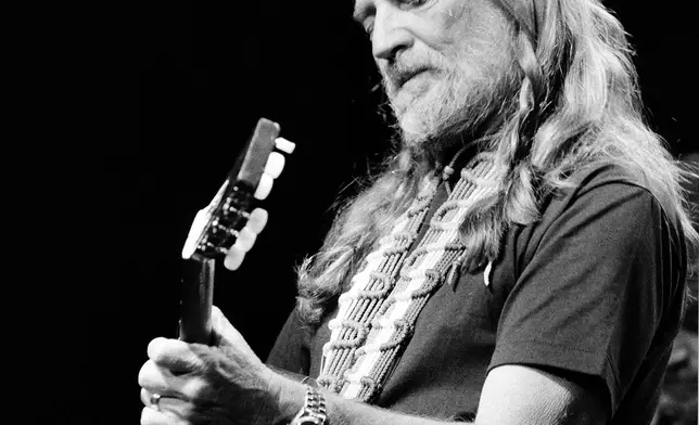 FILE - Willie Nelson performs at New York's Radio City Music Hall Thursday night in the first of six sold-out concerts, May 25, 1984. (AP Photo/Richard Drew, File)