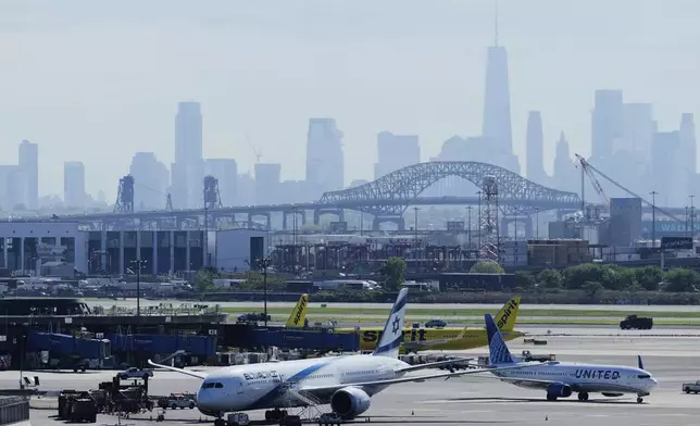 FILE - The New York City skyline is seen behind Newark Liberty International Airport in Newark, N.J., Wednesday, May 7, 2025. (AP Photo/Seth Wenig)