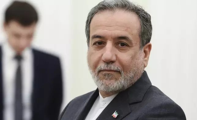 Iranian Foreign Minister Abbas Araghchi stands waiting to meet Russian President Vladimir Putin for the talks at the Kremlin in Moscow, Russia, Monday, June 23, 2025. (Alexander Kazakov, Sputnik, Kremlin Pool Photo via AP)