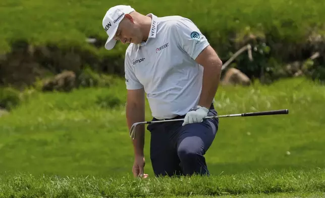 Sepp Straka reacts after his chip shot onto the fourth green during the final round of the Memorial golf tournament Sunday, June 1, 2025, in Dublin, Ohio. (AP Photo/Sue Ogrocki)
