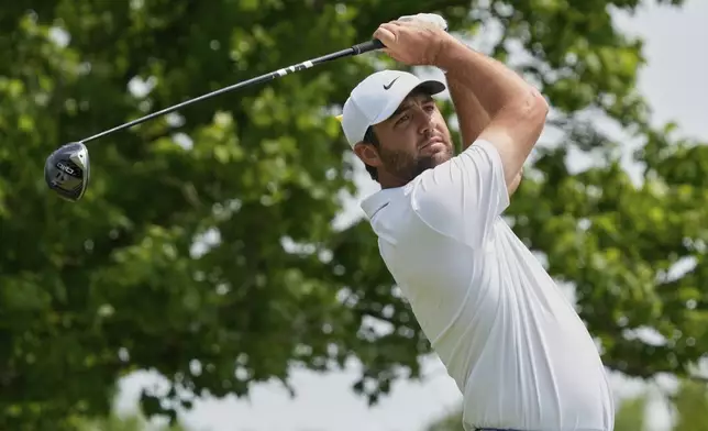 Scottie Scheffler hits from the fifth tee during the final round of the Memorial golf tournament Sunday, June 1, 2025, in Dublin, Ohio. (AP Photo/Sue Ogrocki)