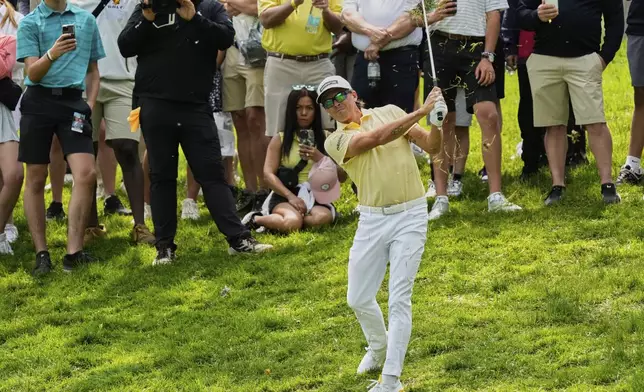 Rickie Fowler hits from the rough on the second hole during the final round of the Memorial golf tournament Sunday, June 1, 2025, in Dublin, Ohio. (AP Photo/Sue Ogrocki)