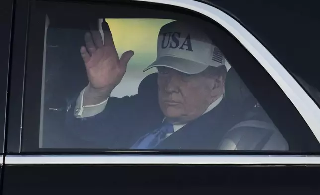 President Donald Trump waves after arriving at Amsterdam Schiphol Airport ahead of the NATO summit, taking place in The Hague, Netherlands, Tuesday, June 24, 2025. (AP Photo/Peter Dejong)