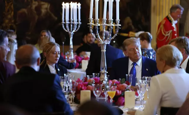 President Donald Trump, center right, and Italy's Prime Minister Giorgia Meloni, center left, attend a dinner for NATO heads of state and government at the Paleis Huis ten Bosch ahead of the NATO summit in The Hague, Netherlands, Tuesday, June 24, 2025. (Remko de Waal, Pool Photo via AP)