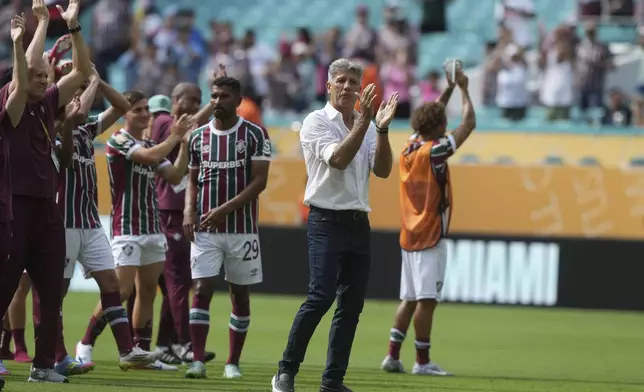 Fluminense manager Renato Gaucho and players thank their supports after the Club World Cup Group F soccer match between Mamelodi Sundowns and Fluminense in Miami Gardens, Fla., Wednesday, June 25, 2025. (AP Photo/Marta Lavandier)