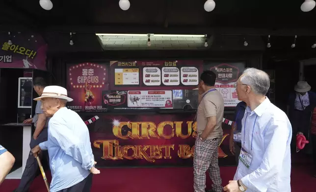 Spectators leave after watching a daily regular performance in Ansan, South Korea, Tuesday, June 10, 2025. (AP Photo/Lee Jin-man)