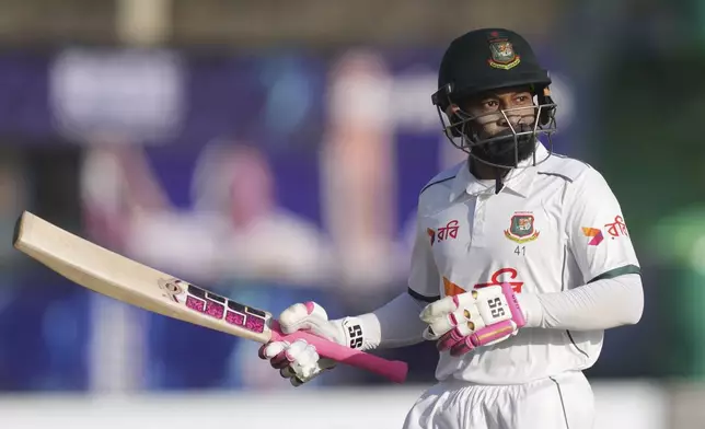 Bangladesh's Mushfiqur Rahim leaves the ground after losing his wicket during the second day of the first cricket test match between Sri Lanka and Bangladesh in Galle, Sri Lanka, Wednesday, June 18, 2025. (AP Photo/Eranga Jayawardena)