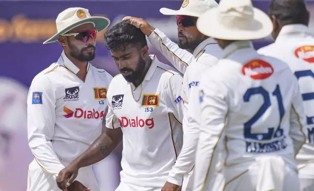 Sri Lanka's Asitha Fernando, second left, celebrates the wicket of Bangladesh's captain Najmul Hossain Shanto during the second day of the first cricket test match between Sri Lanka and Bangladesh in Galle, Sri Lanka, Wednesday, June 18, 2025. (AP Photo/Eranga Jayawardena)