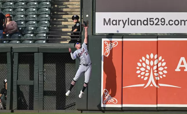 Detroit Tigers outfielder Kerry Carpenter (30) catches a fly ball hit by Baltimore Orioles' Jordan Westburg off Tigers pitcher Tarik Skubal during the first inning of a baseball game in Baltimore, Thursday, June 12, 2025. (AP Photo/Terrance Williams)