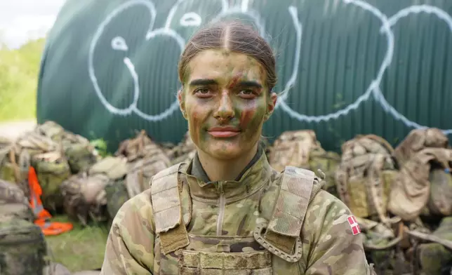 21-year-old conscript Anne Sofie poses for a photo during final exercises at a training area close to Royal Danish Army’s barracks in Hovelte, 25 kilometres north of Copenhagen, Denmark, Wednesday, June 11, 2025. (AP Photo/James Brooks)