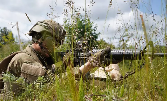 A young conscript aims his rifle during final exercises at a training area close to Royal Danish Army’s barracks in Hovelte, 25 kilometres north of Copenhagen, Denmark, Wednesday, June 11, 2025. (AP Photo/James Brooks)