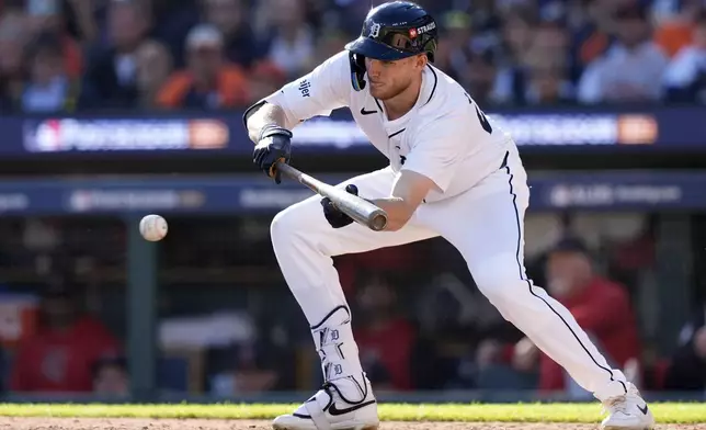 FILE - Detroit Tigers' Parker Meadows attempts to bunt in the fifth inning during Game 3 of a baseball American League Division Series against the Cleveland Guardians, Wednesday, Oct. 9, 2024, in Detroit. (AP Photo/Carlos Osorio, File)