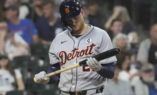 Detroit Tigers' Parker Meadows checks his bat during the sixth inning of a baseball game against the Chicago White Sox in Chicago, Monday, June 2, 2025. (AP Photo/Nam Y. Huh)