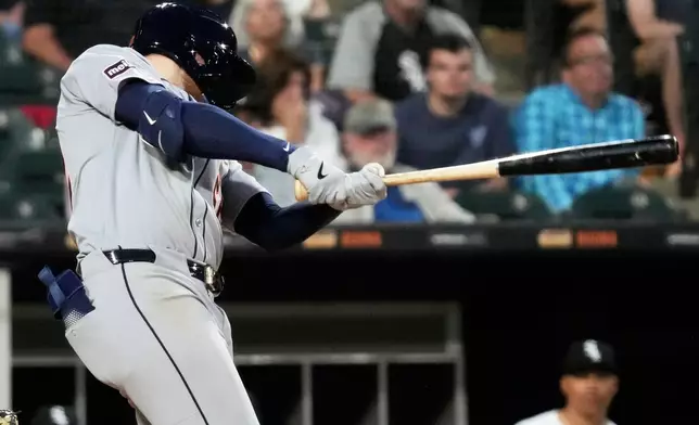 Detroit Tigers' Parker Meadows hits a triple during the sixth inning of a baseball game against the Chicago White Sox in Chicago, Monday, June 2, 2025. (AP Photo/Nam Y. Huh)