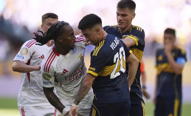 Benfica's Renato Sanches, left, and Boca Juniors' Alan Velasco confront each other during the Club World Cup group C soccer match between Boca Juniors and Benfica in Miami Gardens, Fla., Monday, June 16, 2025. (AP Photo/Rebecca Blackwell)