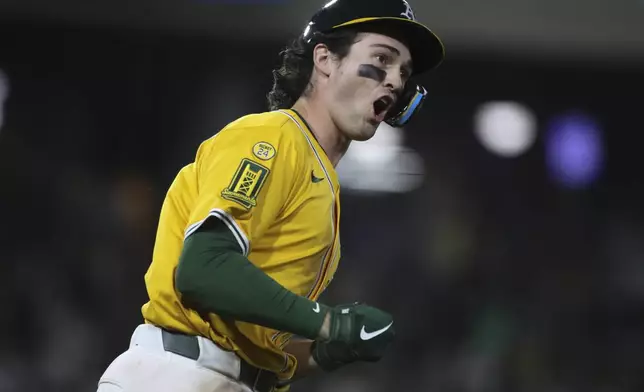 Athletics' Jacob Wilson reacts after hitting a solo home run against the Houston Astros during the seventh inning of a baseball game Thursday, June 19, 2025, in West Sacramento, Calif. (AP Photo/Scott Marshall)