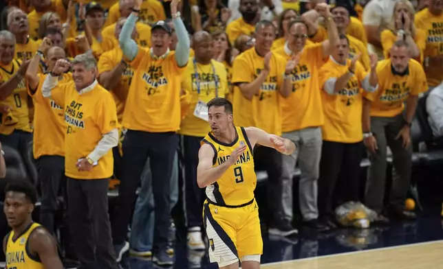 Indiana Pacers guard T.J. McConnell celebrates a basket against the Oklahoma City Thunder during the second half of Game 3 of the NBA Finals basketball series, Wednesday, June 11, 2025, in Indianapolis. (AP Photo/Abbie Parr)