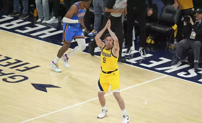 Indiana Pacers guard T.J. McConnell (9) motions after a basket against the Oklahoma City Thunder during the second half of Game 3 of the NBA Finals basketball series, Wednesday, June 11, 2025, in Indianapolis. (AP Photo/Michael Conroy)