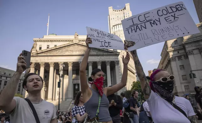 Demonstrators hold signs and chant during a protest against deportation by Immigration and Customs Enforcement in New York, Wednesday, June 11, 2025. (AP Photo/Yuki Iwamura)