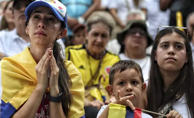 People gather to pray for Colombian Senator Miguel Uribe Turbay's recovery after he was shot at a political rally, in Cali, Colombia, Sunday, June 8, 2025. (AP Photo/Santiago Saldarriaga)