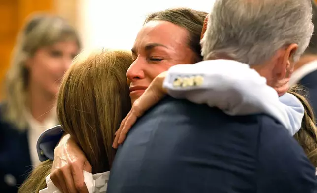 Read hugs her parents Janet and William after the verdict is read in Norfolk Superior Court, Wednesday, June 18, 2025, in Dedham, Mass. (Greg Derr/The Patriot Ledger via AP, Pool)