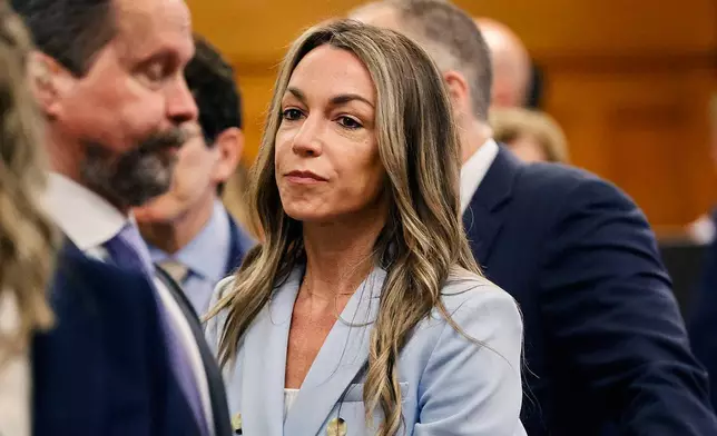 Karen Read watches jurors enter the courtroom to resume deliberations during her trial at Norfolk Superior Court, Wednesday, June 18, 2025, in Dedham, Mass. (Greg Derr/The Patriot Ledger via AP, Pool)