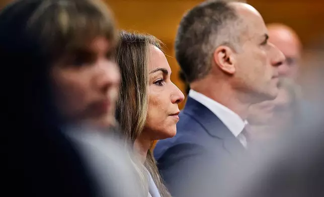 Karen Read and her defense team listen to Judge Beverly Cannone as she instructs the jury to continue their deliberations during her trial at Norfolk Superior Court, Wednesday, June 18, 2025, in Dedham, Mass. (Greg Derr/The Patriot Ledger via AP, Pool)