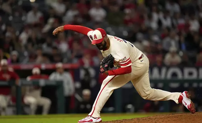 Los Angeles Angels relief pitcher Kenley Jansen throws to the plate during the ninth inning of a baseball game against the Seattle Mariners, Saturday, June 7, 2025, in Anaheim, Calif. (AP Photo/Mark J. Terrill)