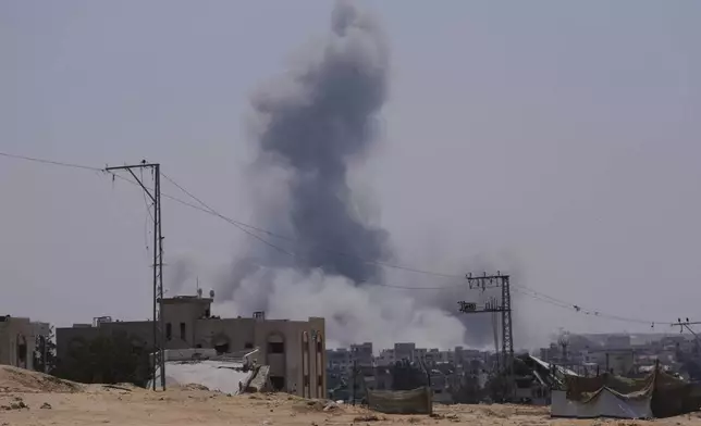 Smoke rises from an Israeli army airstrike east of Khan Younis, Gaza, Sunday, June 8, 2025. (AP Photo/Abdel Kareem Hana)