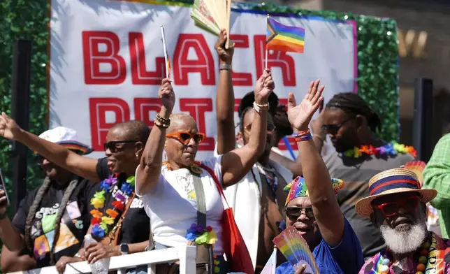 Participants dance on a float during the World Pride parade, Saturday, June 7, 2025, in Washington. (AP Photo/Mark Schiefelbein)