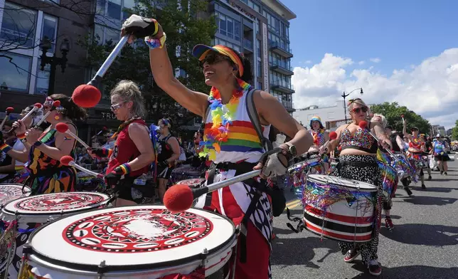 Members of Batalá Washington D.C. perform during the World Pride parade, Saturday, June 7, 2025, in Washington. (AP Photo/Alex Brandon)
