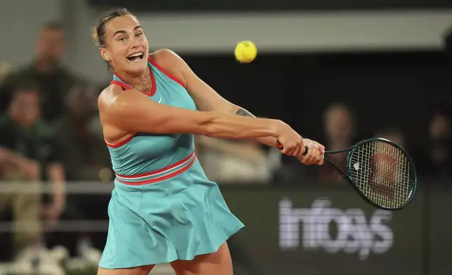 Aryna Sabalenka of Belarus plays a shot against Poland's Iga Swiatek during their semifinal match of the French Tennis Open at the Roland-Garros stadium in Paris, Thursday, June 5, 2025. (AP Photo/Thibault Camus)