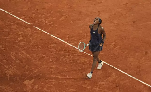Coco Gauff of the U.S. celebrates as she won the semifinal match of the French Tennis Open against France's Lois Boisson at the Roland-Garros stadium in Paris, Thursday, June 5, 2025. (AP Photo/Thibault Camus)